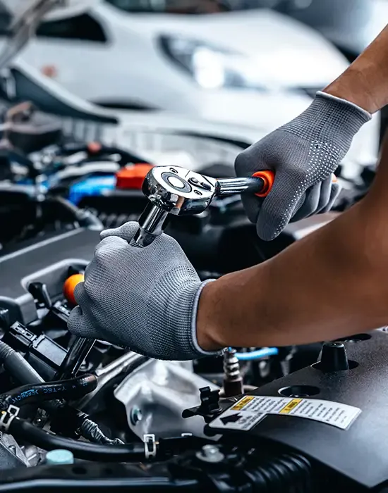 Independent VAG Specialist in Cambridge at Station Road Garage Mechanic working on a Volkswagen Audi Group vehicle engine at Station Road Garage, independent VAG specialist in Cambridge.