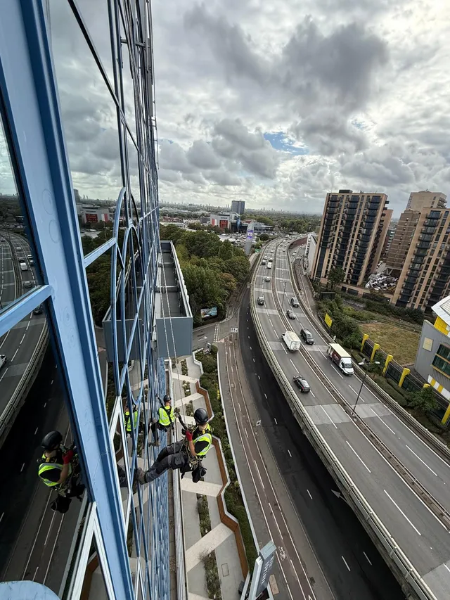 Using rope to work on glass exterior