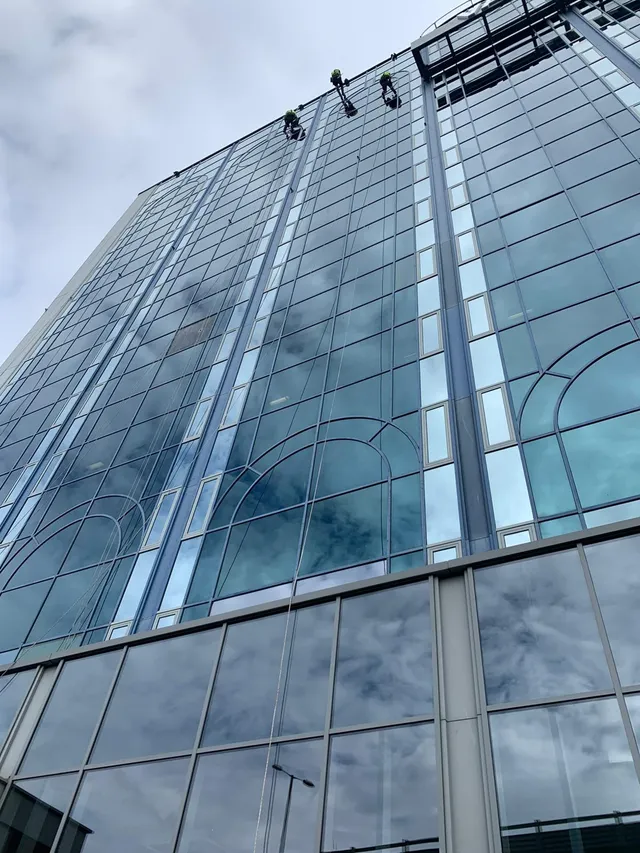 Rope access to large glass windows