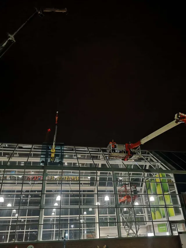 Replacing atrium glass at night
