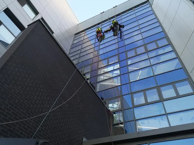 Using rope access to maintain glazing