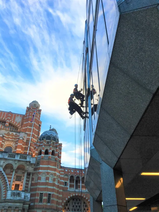 Using rope access to work on glazing